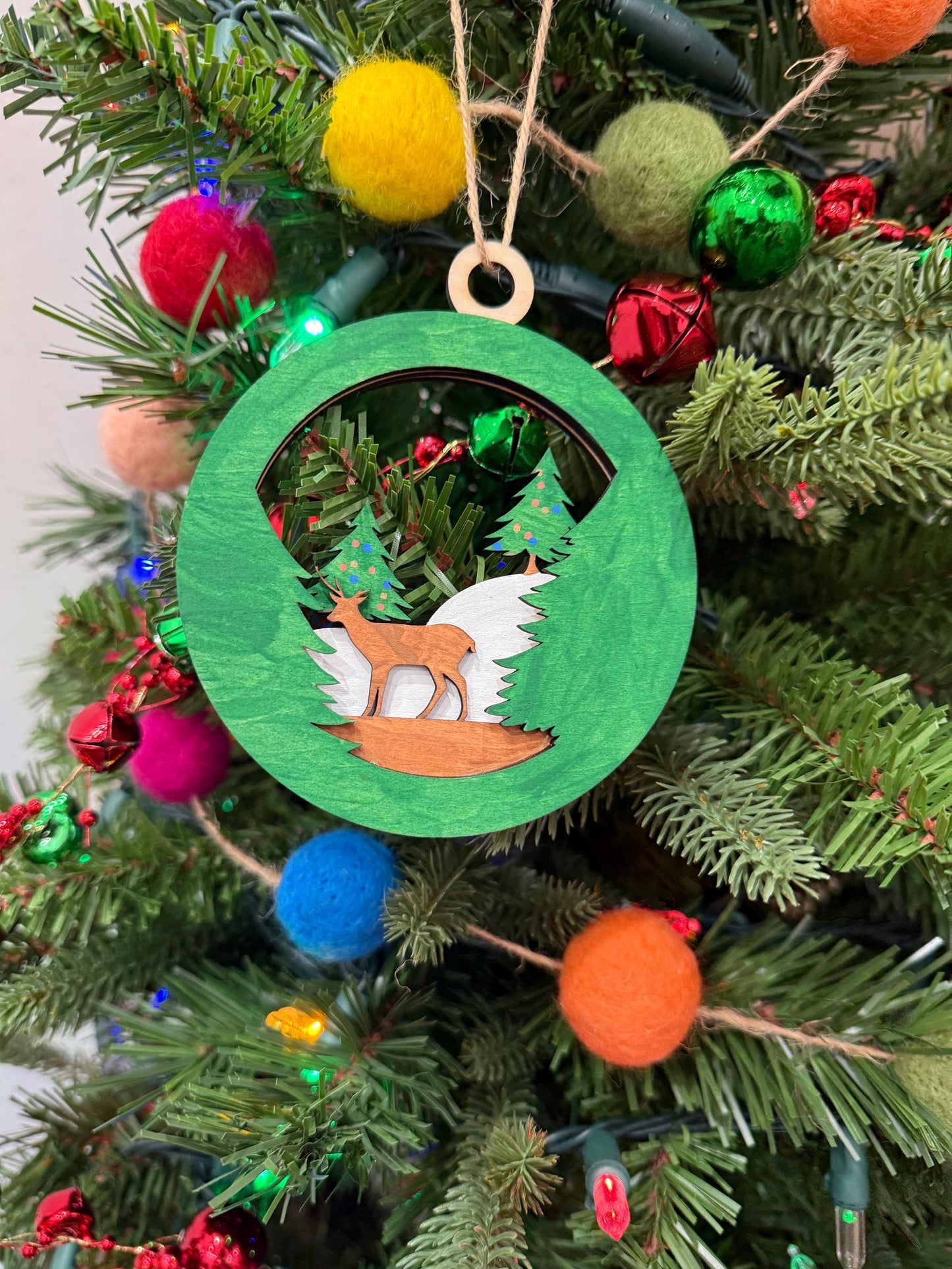 Handcrafted Wooden Deer Ornament for Holiday Decor - Festive Forest Scene with Evergreen Trees