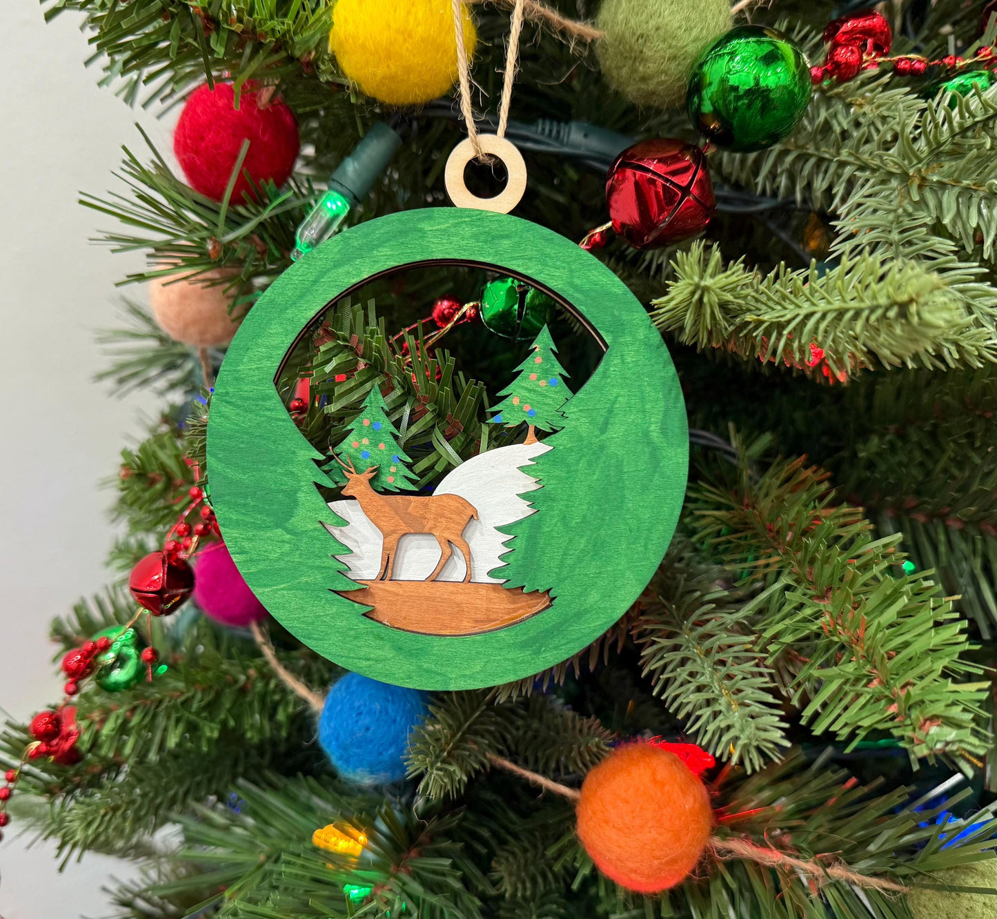 Handcrafted Wooden Deer Ornament for Holiday Decor - Festive Forest Scene with Evergreen Trees